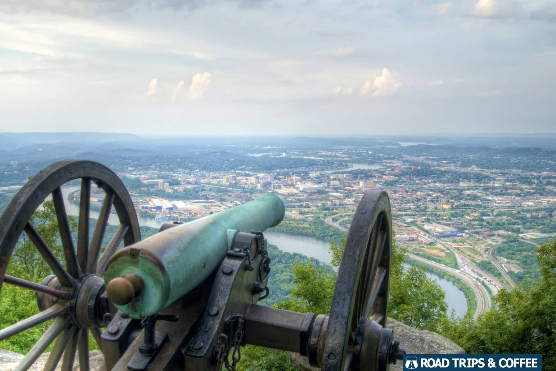 A canon on display at Point Park with a view of downtown Chattanooga, Tennessee in the distance